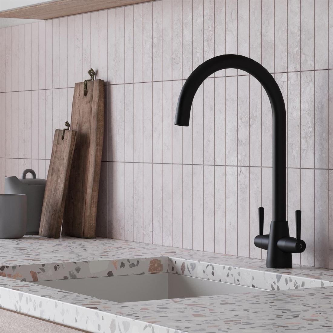 Liquida black composite 1.5 bowl kitchen sink with reversible drainer and black mixer tap installed in modern kitchen